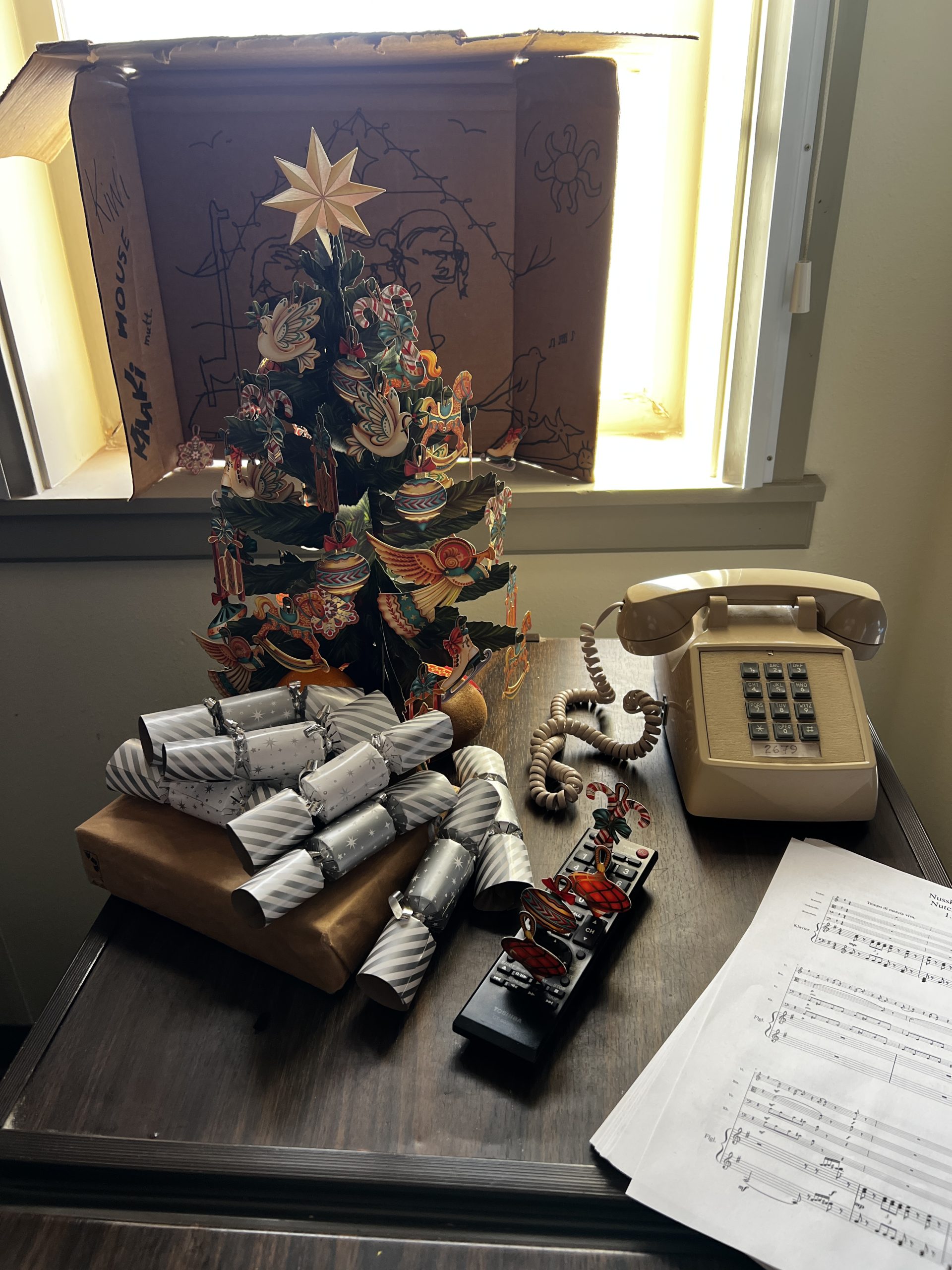 Our backlit Christmas tree and nativity scene setup on top of the fridge