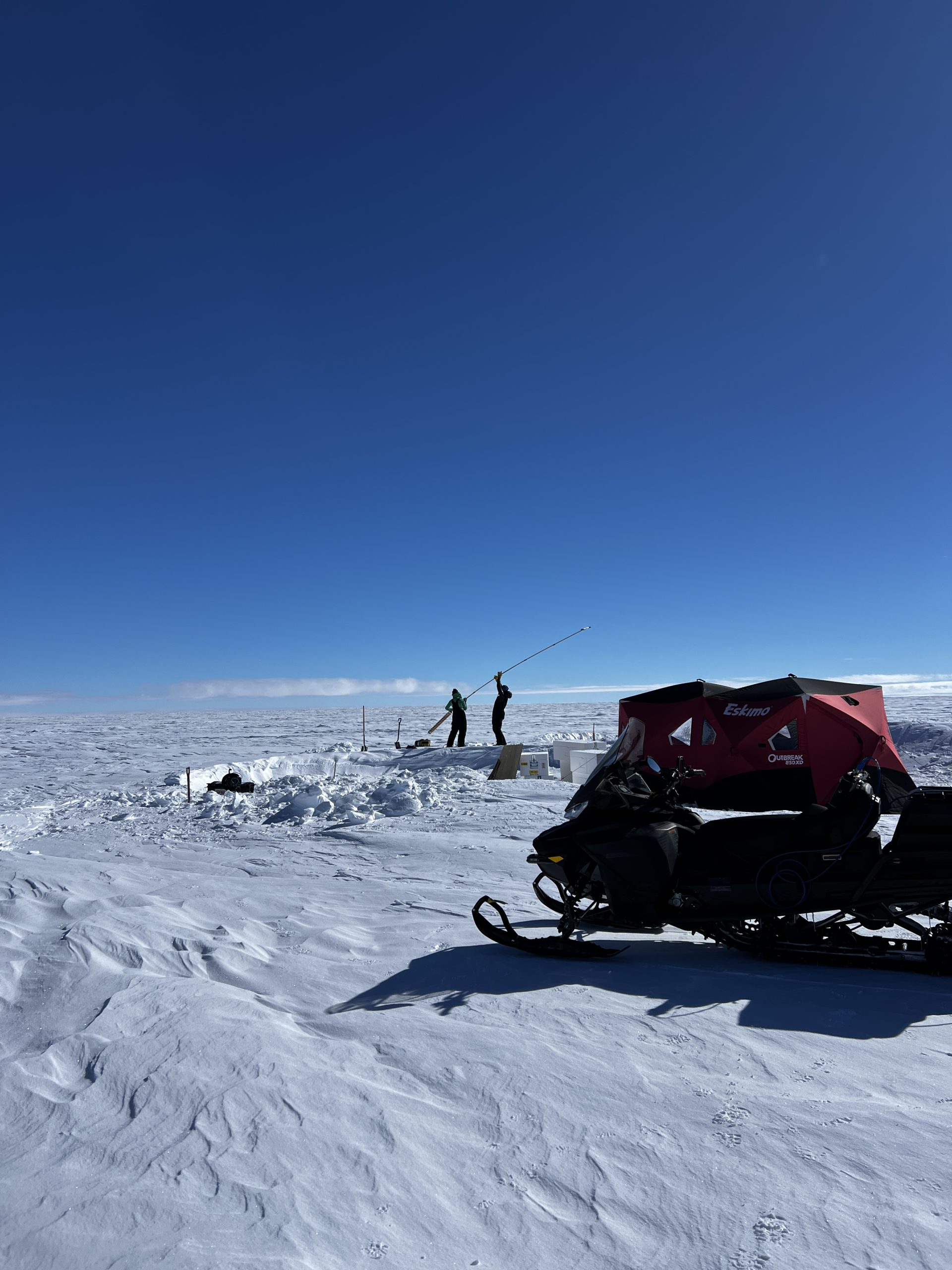 Dylen and Ilyse and their 7 meter long hand auger at the 8 cm site