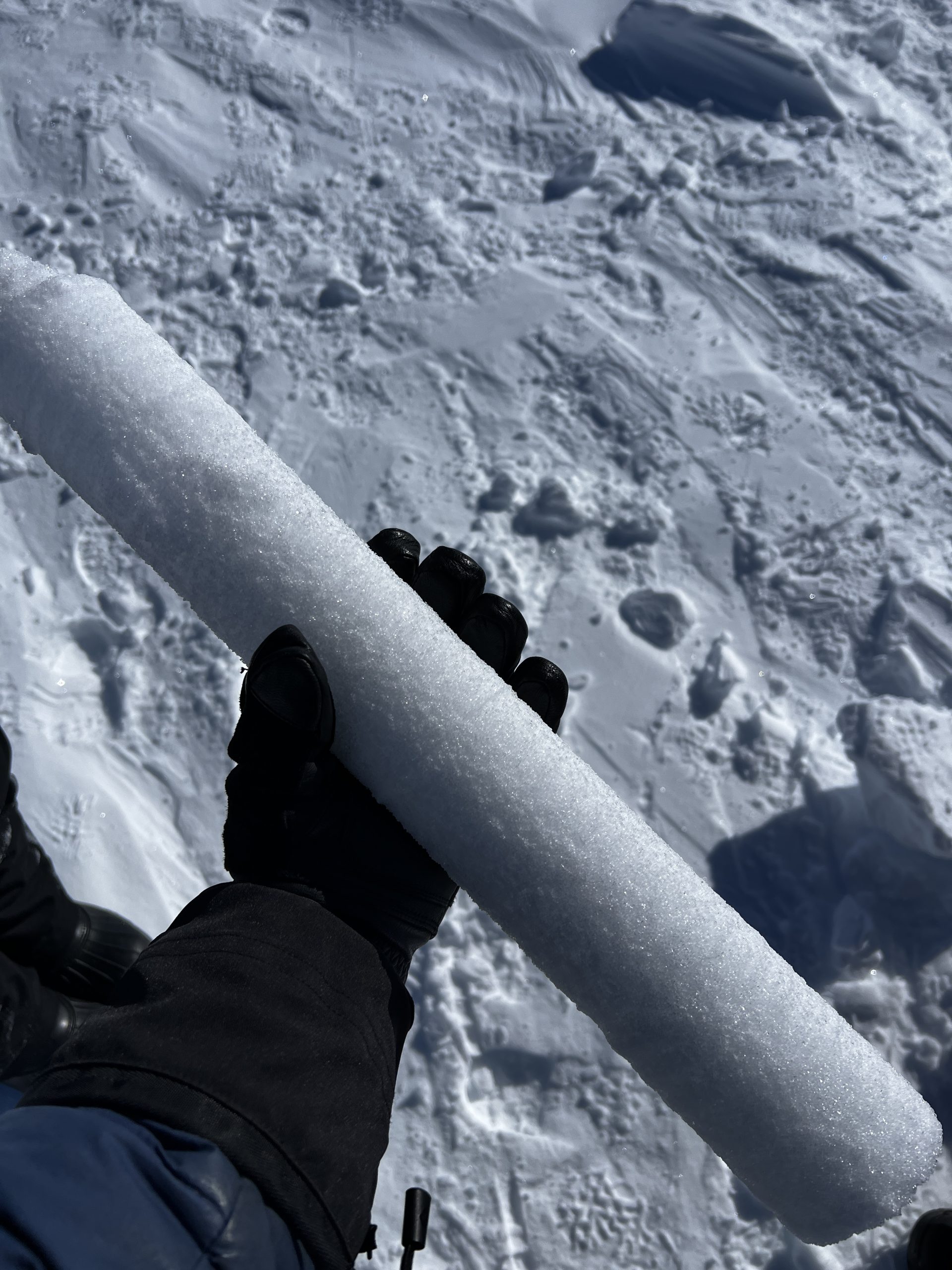 Holding a firn core (to be discarded)