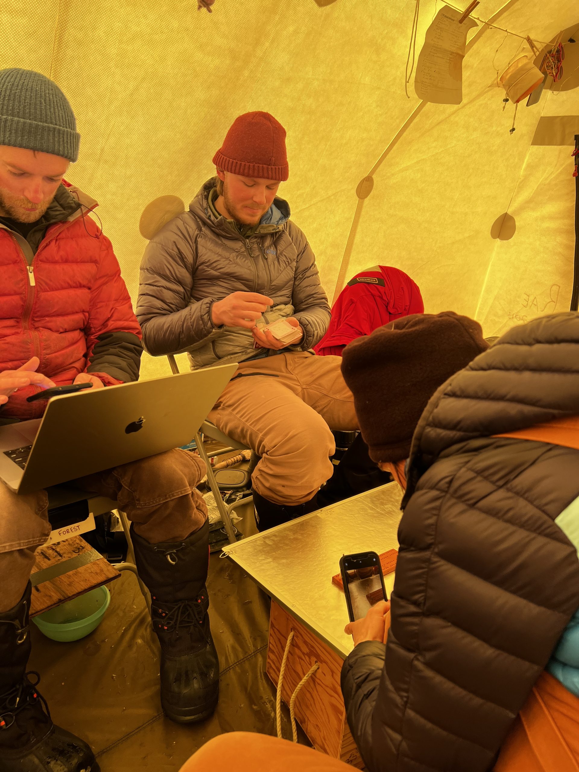 Documenting Ellen as she documents the cribbage pieces