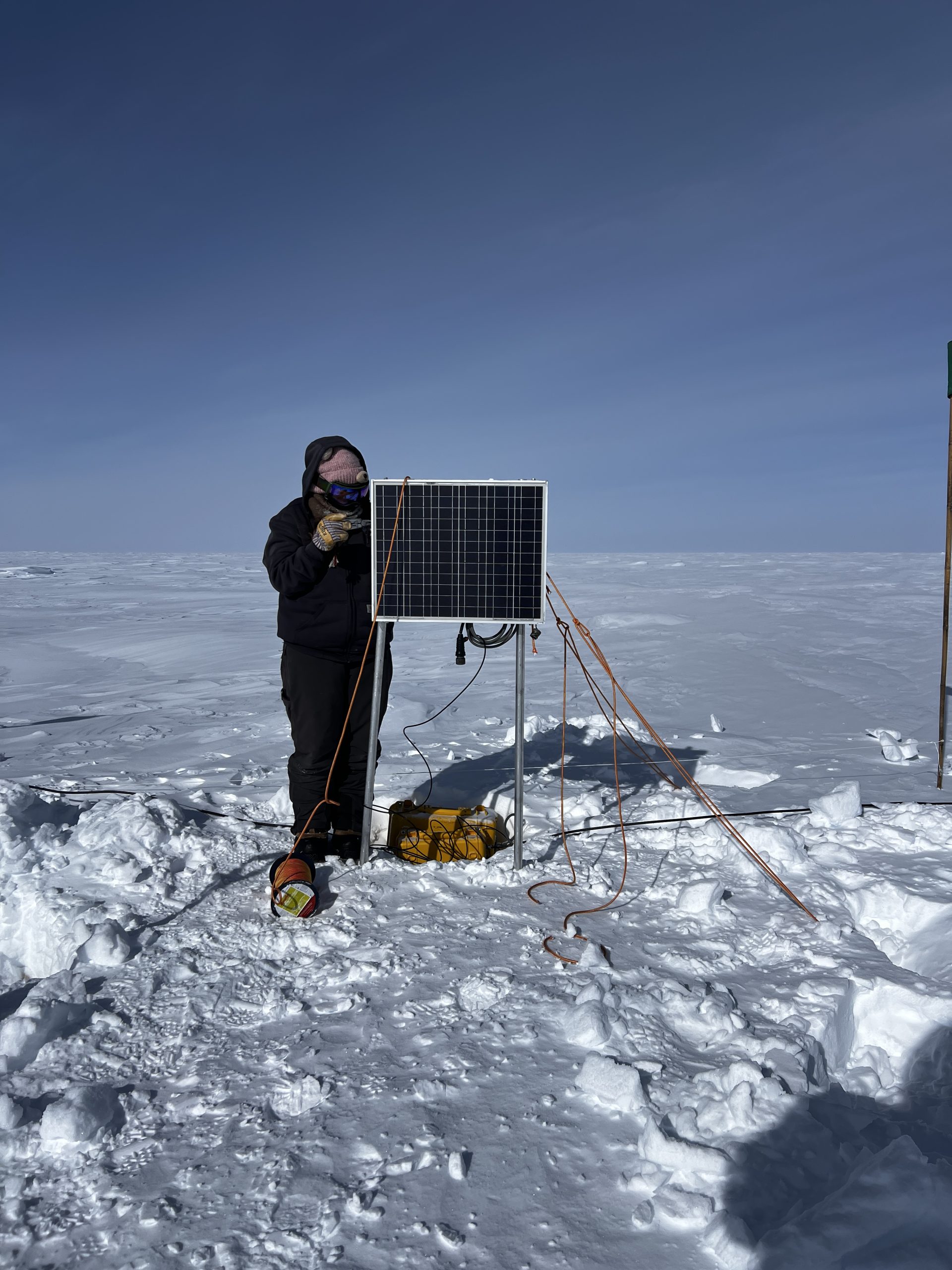 Zoe setting up the solar panel at the ApRES site