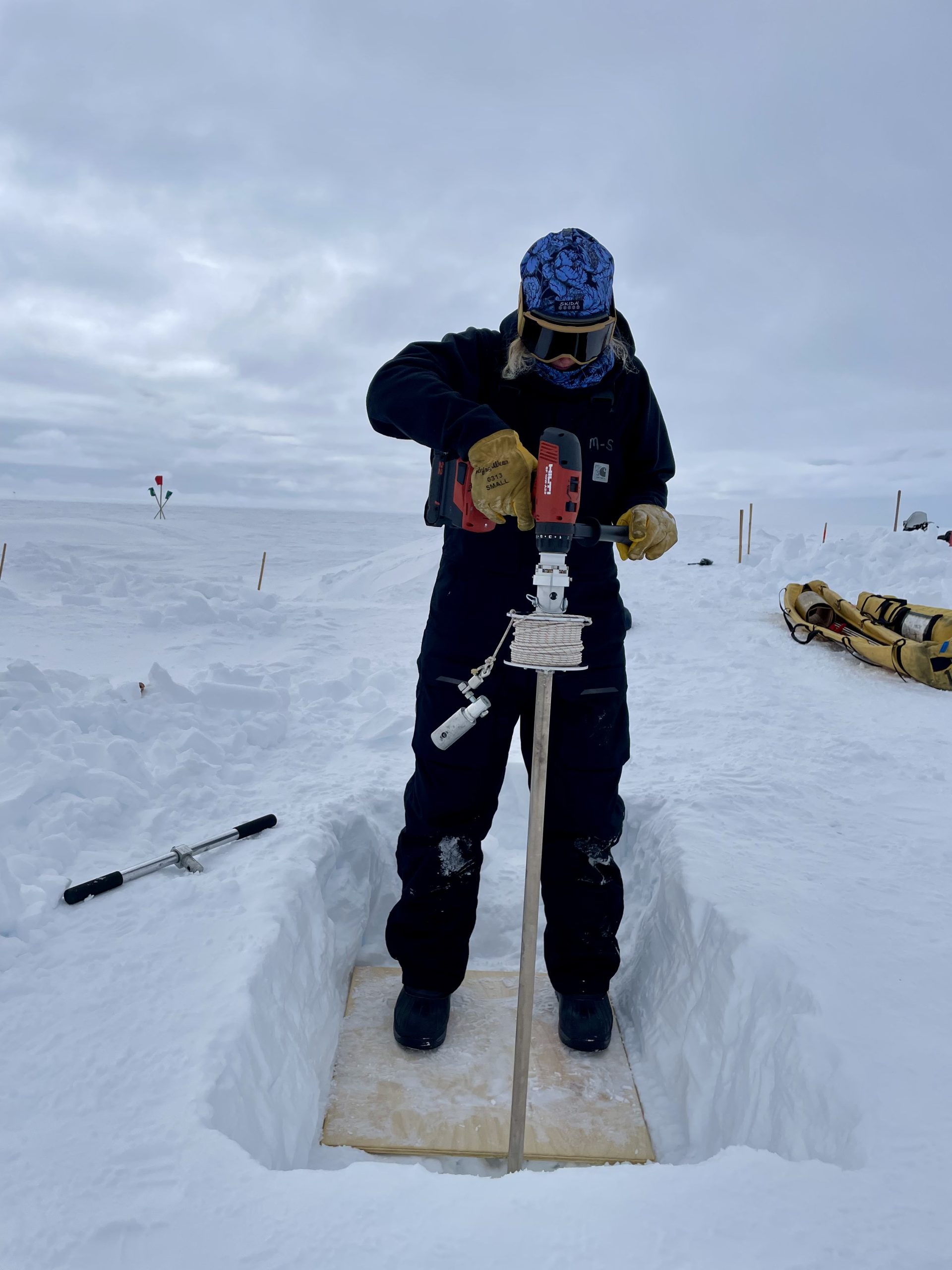 Dylen hand augering holes with the sidewinder drill