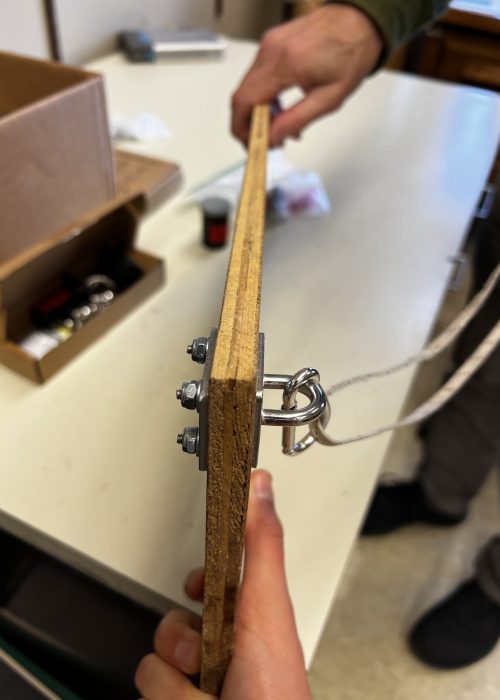 Practicing construction of a mechanism to secure a cable drum on the ice